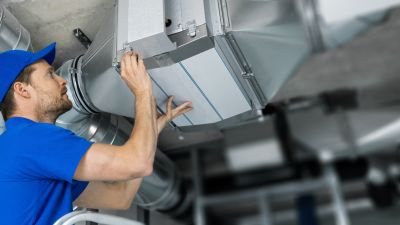 HVAC check by professional maintenance serviceman